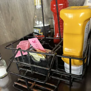 Rusty, greasy, dusty condiment holder