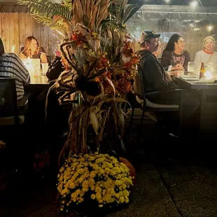 Guest enjoying our full enclosed gazebos  with fire tables for year round outdoor dining