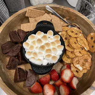 a bowl of s&apos;mores and strawberries