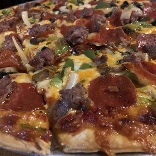 Homemade Cheese Pizza w/ Pepperoni, sausage, onion, mushroom, green pepper, and black olive