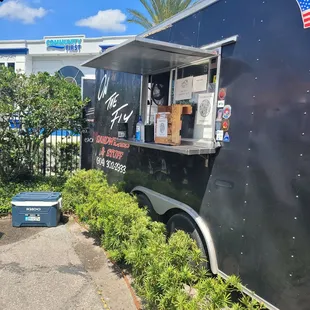 a food truck parked on the side of the road