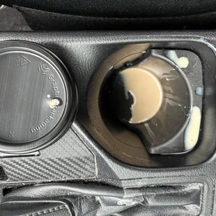 Grossly overfilled cup.  Pick it up and lid pops off.  Coffee spurts all over.