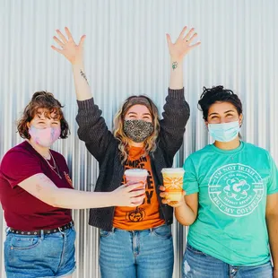 three women with face masks on