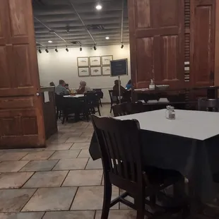 a dining room with tables and chairs