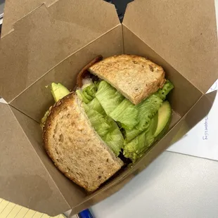 Breakfast sandwich (avocado, lettuce, Swiss cheese, over easy egg, and bacon). Tastes amazing