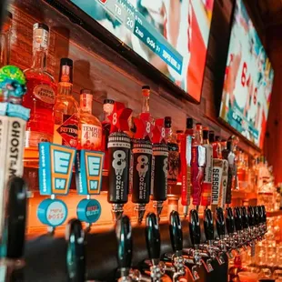 a row of beer taps