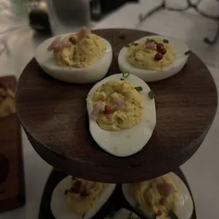 NINES DEVILED EGGS( Virginia ham, black truffle, smoked salt, pink peppercorn