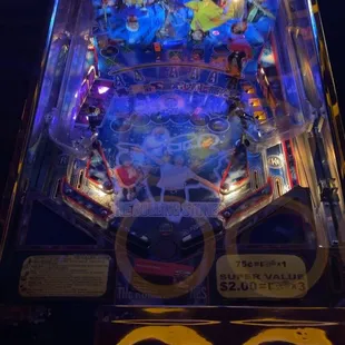 a pinball machine in a dark room