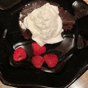 Dessert.  Flourless Chocolate Torte.  (serving suggestion.  I added the whipped cream and raspberries)