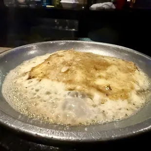 Flaming cheese served with pita bread