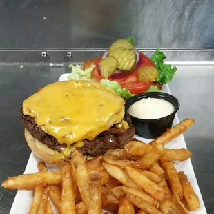 Bacon Breakfast Burger with a fried egg under melted cheese.