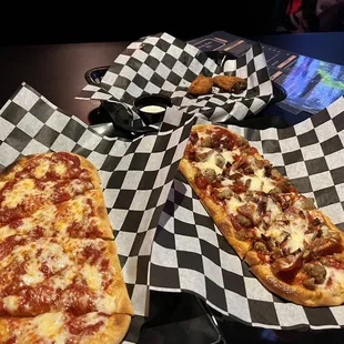 Cheese pizza, meat lovers pizza, and a couple jalapeño poppers