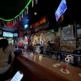 a woman sitting at a bar