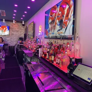 a bar with purple lighting