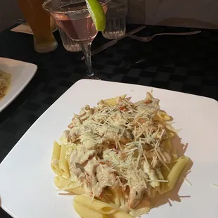 My wife loves the penne Milano! Watermelon martini with sugar rim in the back. Also her new favorite.