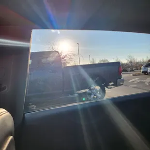 Light coming through the side window that was supposed to be as dark as the roof.