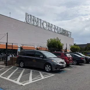 a group of cars parked in a parking lot