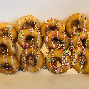 A Dozen sprinkles with vanilla drizzle $8