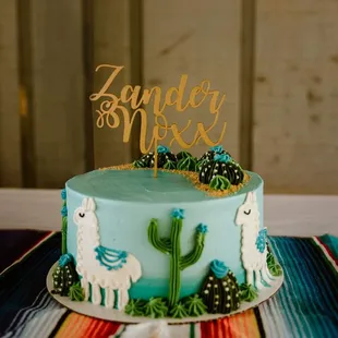 a cake decorated with llamas