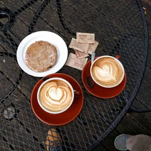 two cups of coffee on a table