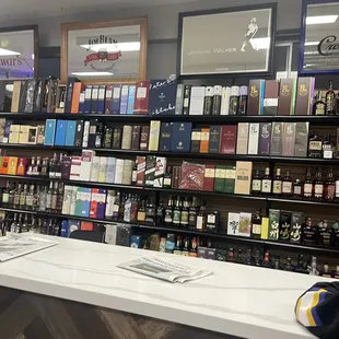 a shelf of wine in a liquor store