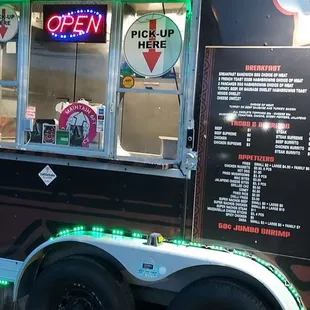 a food truck with neon lights