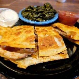 a plate of quesadillas and greens