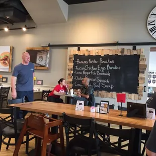 a man standing in front of a blackboard