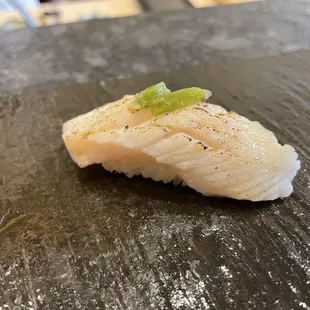 I don't remember the fish but that's pickled wasabi on top. Neat. :)