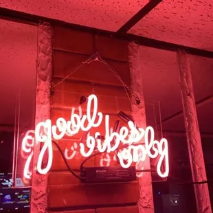 a neon sign that says goodbye