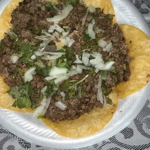 The cilantro is brown and there is bits of char is the food.