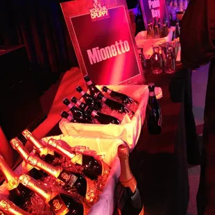 bottles of champagne and bottles of wine on a table