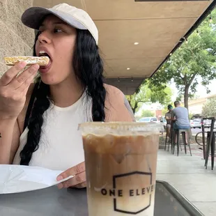 a woman eating a slice of pizza