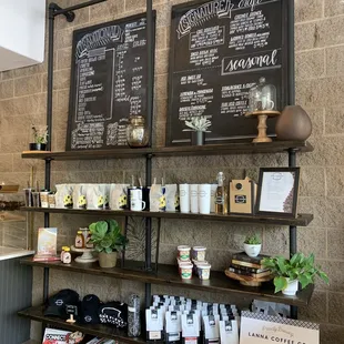 the menus on the wall of a coffee shop