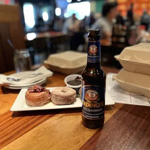 Assorted gourmet donuts and N/A beverage.