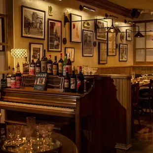 a piano in a dimly lit restaurant