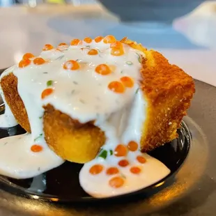 Signature cornbread with dill cultured cream and smoked trout roe
