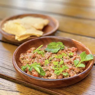 Beef Tartare w/ calabrian chili, cashew, housemade crackers | $18