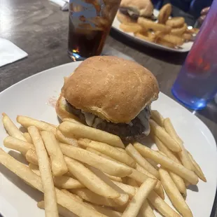 Mushroom and Swiss hamburger with fries.