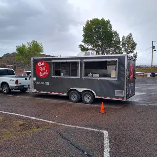 a truck pulling a food truck