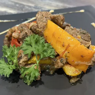 a plate of meat and vegetables