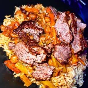 a plate of meat and rice