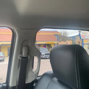 a view from the back seat of a car