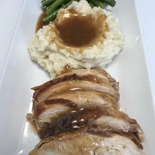 Roasted turkey mashed potatoes and gravy season green beans
