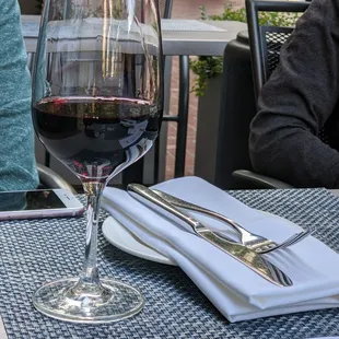 a glass of wine on a table