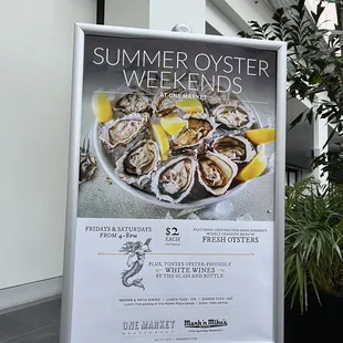 a sign for the summer oyster weekend