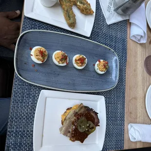 mozzarella sticks, deviled eggs, and pulled pork latkes