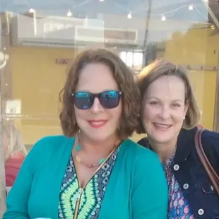 two women sitting at a table