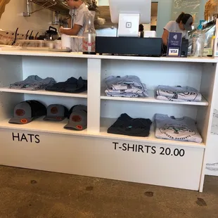 a display of hats and t - shirts
