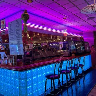 a bar with neon lights